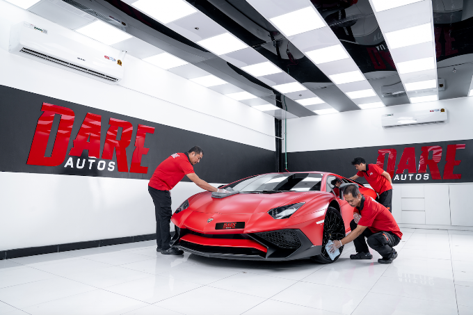 Dare Autos workshop team working on a car