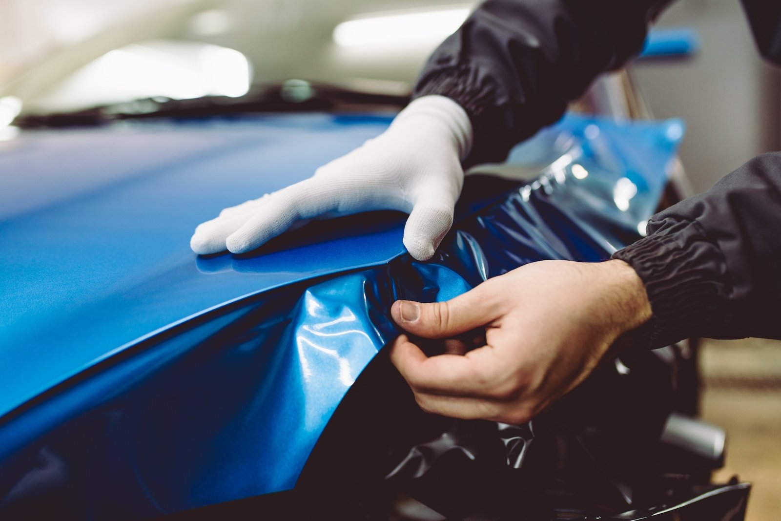 Technician detailing the interior of a car